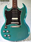 Photo Reference used left hand guitar electric Gibson SG Special Teal 2002